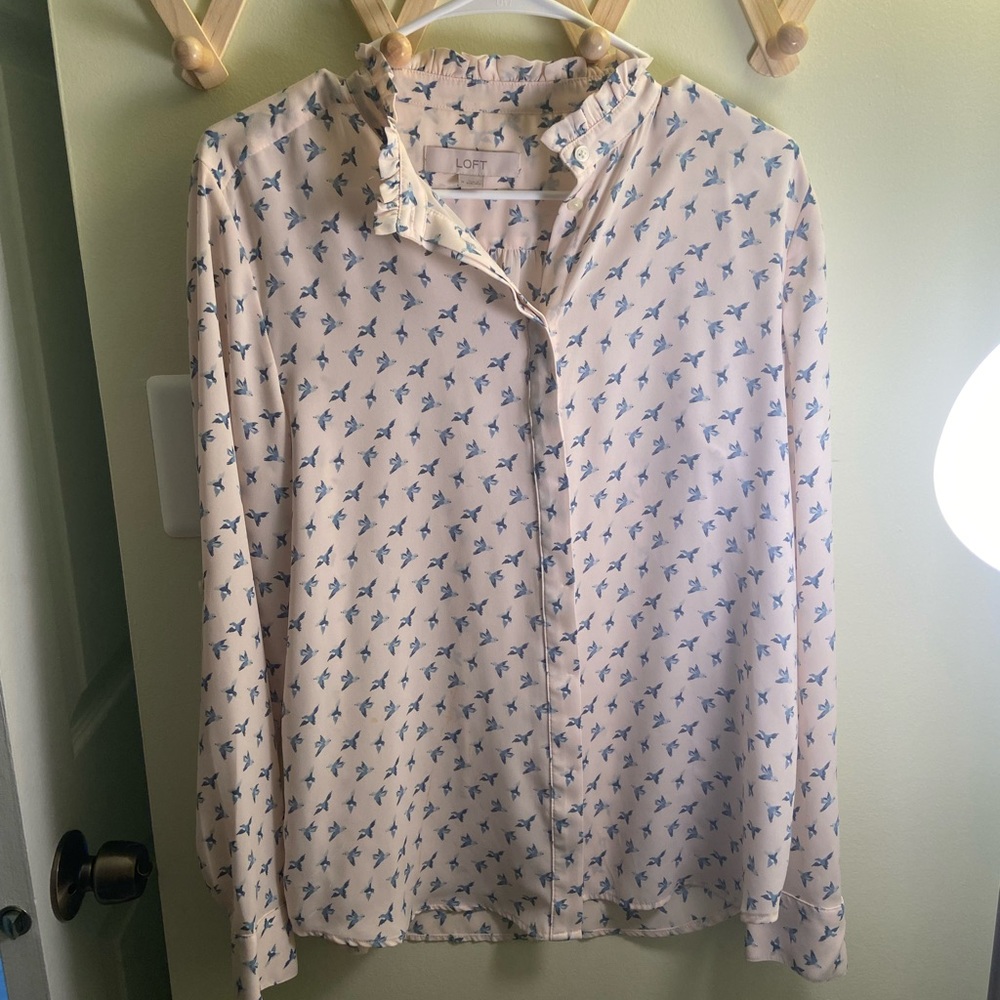 Beautiful ruffled collar buttoned front top with full sleeve